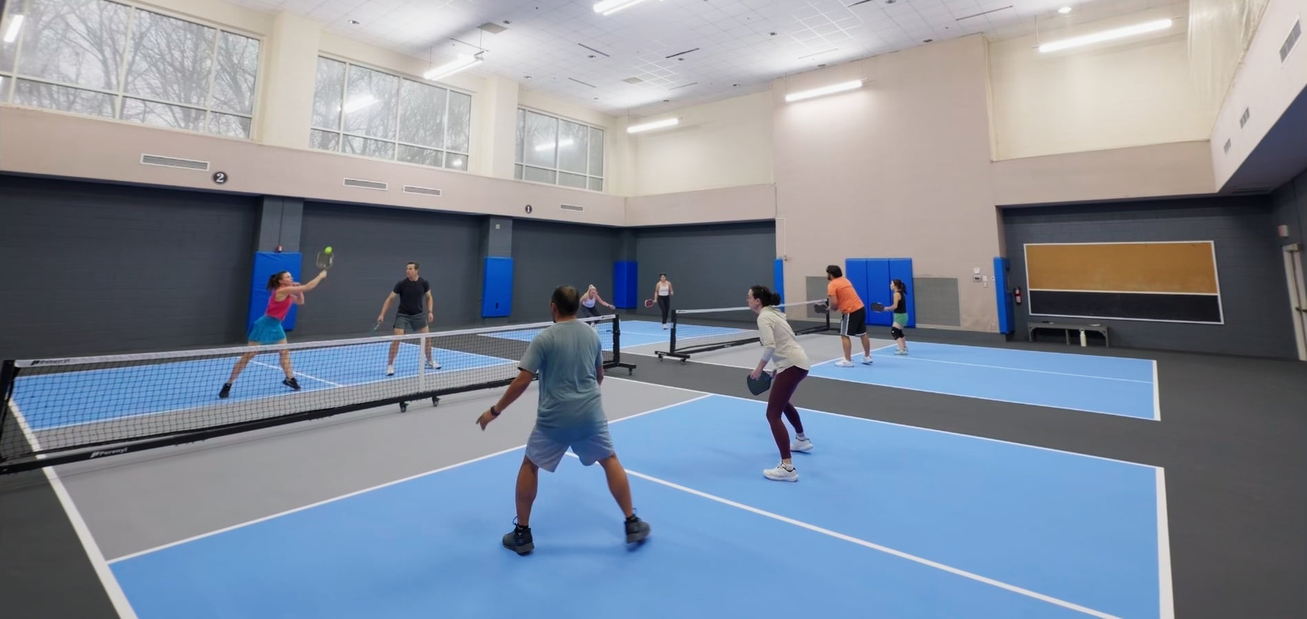 club fitness people playing Pickleball